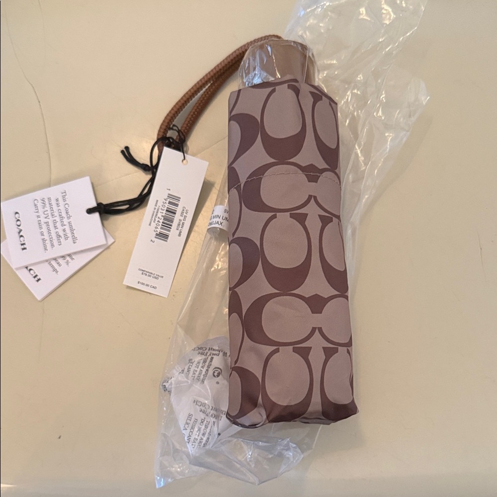 Coach mini umbrella… Brand new , never opened.